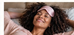 Woman resting comfortably in bed